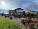 Brick home with large windows and patio, offering lake views at 121 48Th Ne Ave, Hickory, NC 28601