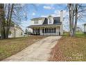 House exterior with a driveway and landscaping at 1324 Eagles Landing Dr, Charlotte, NC 28214