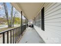 Side view of front porch with seating area at 1324 Eagles Landing Dr, Charlotte, NC 28214