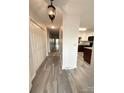 Bright hallway with wood-look floors leading to kitchen at 213 Eastwood Dr, Salisbury, NC 28146