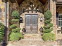 Impressive double front doors with a stone entryway and lush landscaping at 539 Medora Ln # 62, Fort Mill, SC 29708