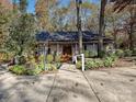 House exterior showcasing a walkway, landscaping, and a beige facade at 25040 Timberlake Dr, Tega Cay, SC 29708