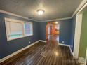 Simple dining room with hardwood floors and blue walls at 3630 Old Mocksville Rd, Salisbury, NC 28144