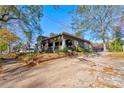 Gray craftsman home with a large yard and mature trees at 600 W Warren St, Shelby, NC 28150