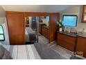 Main bedroom with mirrored closet and wood cabinets at 204 Lake Tillery Trl, Mount Gilead, NC 27306