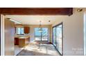 Bright dining area with sliding glass doors leading to the backyard at 7524 Eastbourne Rd, Charlotte, NC 28227