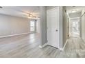 Bright entryway with light gray walls and wood-look flooring at 14320 Carolina Forest Ct, Charlotte, NC 28273