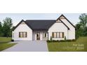 White brick home with dark gray roof, brown garage door, and landscaping at 150A Lookout Dam Rd, Statesville, NC 28625