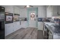 Galley kitchen with white cabinets and granite countertops at 3842 22Nd Street Ne Ct, Hickory, NC 28601