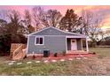 Newly renovated craftsman style home with a deck and walkway at 5318 Green Rd, Stanley, NC 28164