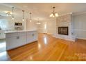 Renovated kitchen with island and hardwood floors at 6815 Castlegate Dr, Charlotte, NC 28226