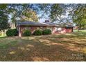 Brick ranch house with attached garage and lawn at 4620 Sherrills Ford Rd, Salisbury, NC 28147