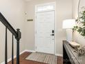 Bright entryway with interior door, console table, and hardwood floors at 5526 Whitehawk Hill Rd, Mint Hill, NC 28227