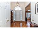 Bright entryway with hardwood floors, an arched window, and built-in shelving at 5924 Newell Dr, Monroe, NC 28112