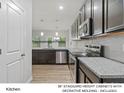 Modern kitchen with dark cabinets and granite countertops at 7310 Greenrock Ct, Charlotte, NC 28215