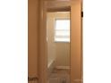 Simple bathroom with a bathtub, tiled floor, and a window with blinds at 4605 Coronado Dr, Charlotte, NC 28212