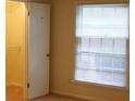 Bedroom with a window, closet, and neutral-colored carpeting at 4605 Coronado Dr, Charlotte, NC 28212