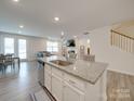Kitchen with island, stainless steel appliances, and open floor plan at 5021 Markfield Ln, Monroe, NC 28110
