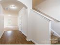 Bright entryway with hardwood floors and view of the living area at 8127 Paw Club Dr, Charlotte, NC 28214