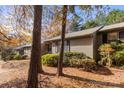 Side view of tan house with trees and landscaping at 924 Cranberry Cir # 50-C, Fort Mill, SC 29715