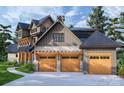 Three car garage with attached home and stone accents at 0 S Potter Rd # 2B, Waxhaw, NC 28173