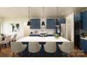 Modern kitchen with blue cabinetry, quartz countertops, and an island at 154A Lookout Dam Rd, Statesville, NC 28625