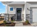 Charming front entrance with stone accents and a dark gray door at 111 Newbold Ln, Mooresville, NC 28115