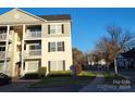 Side view of building, showing multiple units and parking at 1174 Plaza Walk Dr, Charlotte, NC 28215