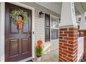 Dark brown front door accented with an orange wreath at 1707 Clemmon Sanders Cir, Rock Hill, SC 29732