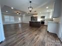 Open concept kitchen with island and stainless steel appliances at 190 Williamson St, Troy, NC 27371