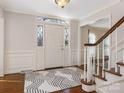 Bright entryway with hardwood floors and staircase at 5129 Little Brook Ln, Charlotte, NC 28226