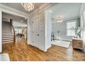 Hardwood floors and an open floor plan connect the entry to the living spaces at 823 Digby Rd, Rock Hill, SC 29730