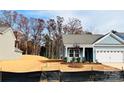 New construction home with gray siding and a white garage door at 1058 Bull Dog Ln, Wingate, NC 28174