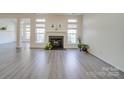 Spacious living room with fireplace and hardwood floors at 11628 Eastwind Dr, Charlotte, NC 28273