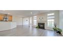 Living room features hardwood floors, fireplace and large windows at 11628 Eastwind Dr, Charlotte, NC 28273