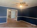 Living room with blue and white walls and carpet at 707 7Th St, Spencer, NC 28159