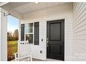 Front porch with rocking chair and black front door at 105 Bess Goforth Dr, Kings Mountain, NC 28086