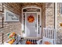 Inviting front porch with autumn decor and rocking chair at 202 Stone Ridge Dr, Salisbury, NC 28146