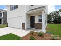 Two-story house with white siding, stone accents, and a two-car garage at 1013 20Th Avenue Se Loop, Hickory, NC 28602