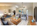 Bright living room with hardwood floors and access to kitchen and dining area at 1239 Kerry Greens Dr, Matthews, NC 28104