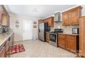 Spacious kitchen with stainless steel appliances and wood cabinets at 1315 Shady Bluff Dr, Charlotte, NC 28211