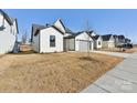 White brick home with gray accents and a spacious front yard at 148 Windy Dell Dr, Tega Cay, SC 29708