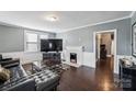 Spacious living room featuring a fireplace and hardwood floors at 415 S Willow St, Gastonia, NC 28034