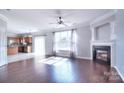 Spacious living room with hardwood floors, fireplace and kitchen views at 9316 Macquarie Ln, Charlotte, NC 28227