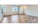 Bright living room with hardwood floors, lots of natural light, and an open concept at 9732 Inkberry Dr, Gastonia, NC 28056