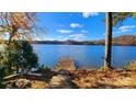 Scenic lakefront property with wooden dock at 228 Sugar Loaf Dr, Troy, NC 27371