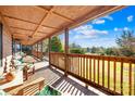 Relaxing wooden front porch with scenic wooded views at 27311 Hedge Rd, Albemarle, NC 28001