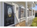 Stylish black front door with glass oval and white columns at 2934 Cripple Creek Ct, Monroe, NC 28110