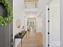 Bright and spacious entryway with hardwood floors and a modern console table at 3837 Bon Rea Dr, Charlotte, NC 28226