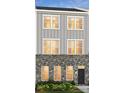 Stunning 3-story townhome with gray siding and brick at 4003 Bourne Ct # Lot 41, Charlotte, NC 28262